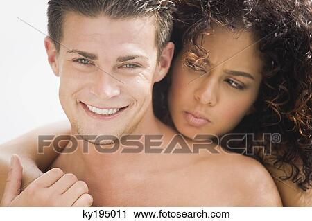 Stock Image - Close-up of a couple romancing. Fotosearch