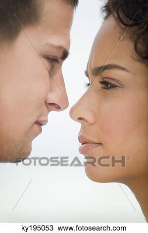 Close-up of a couple romancing View Large Photo Image Stock Image - Close-up of a couple romancing. Fotosearch
