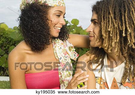 Couple smiling at each other View Large Photo Image Stock Photography - Couple smiling at each other. Fotosearch