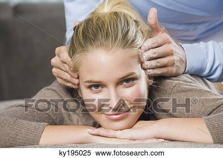 Mid section view of a man rubbing temples of a woman View Large Photo Image Stock Photography - Mid section view of a man rubbing temples of a woman. Fotosearch