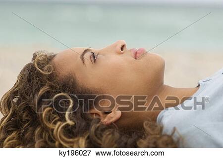 Close-up of a girl day dreaming View Large Photo Image Stock Photo - Close-up of a girl day dreaming. Fotosearch