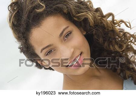 Portrait of a girl smiling View Large Photo Image Stock Image - Portrait of a girl smiling. Fotosearch