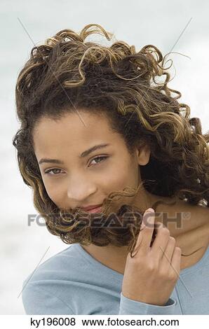 Stock Photo - Portrait of a girl smiling. Fotosearch