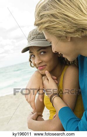 Teenage boy with a girl romancing on the beach View Large Photo Image Stock Image - Teenage boy with a girl romancing on the beach. Fotosearch