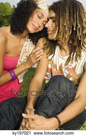 Close-up of a couple romancing View Large Photo Image Stock Image - Close-up of a couple romancing. Fotosearch