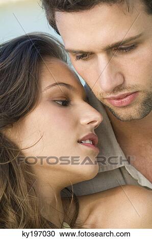 Close-up of a couple romancing View Large Photo Image Stock Image - Close-up of a couple romancing. Fotosearch