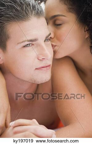 Close-up of a couple romancing View Large Photo Image Stock Photo - Close-up of a couple romancing. Fotosearch