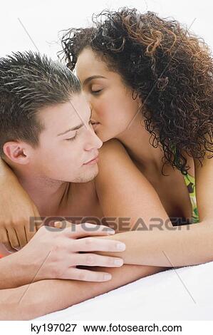 Close-up of a couple romancing View Large Photo Image Stock Photo - Close-up of a couple romancing. Fotosearch