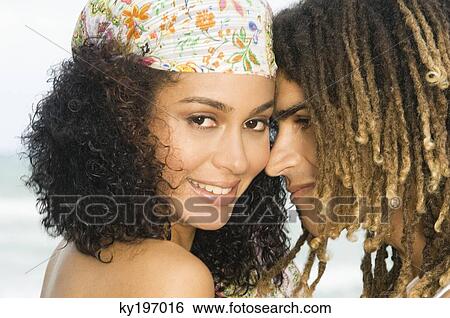 Close-up of a couple romancing View Large Photo Image Stock Photograph - Close-up of a couple romancing. Fotosearch