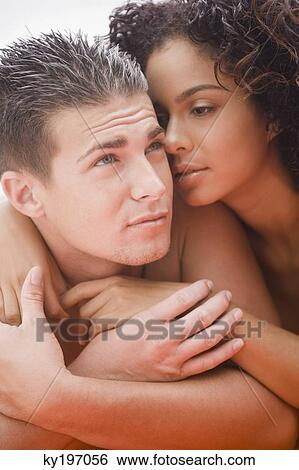Close-up of a couple romancing View Large Photo Image Stock Photograph - Close-up of a couple romancing. Fotosearch