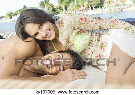 Portrait of a couple resting at a tourist resort View Large Photo Image Stock Photography - Portrait of a couple resting at a tourist resort. Fotosearch