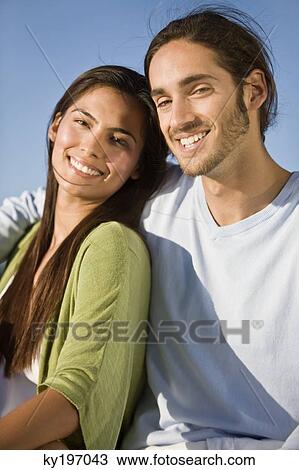Portrait of a couple smiling View Large Photo Image Stock Image - Portrait of a couple smiling. Fotosearch
