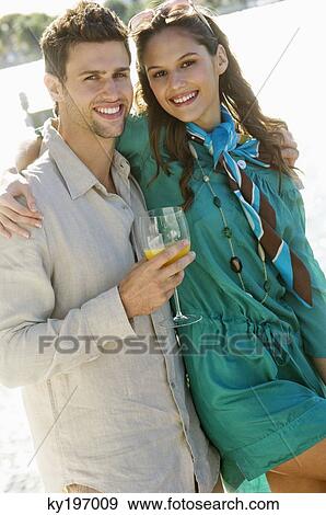 Portrait of a couple smiling View Large Photo Image Stock Photo - Portrait of a couple smiling. Fotosearch