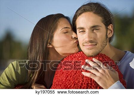Stock Photography - Woman kissing a man. Fotosearch