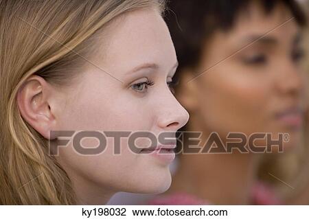 Close-up of a woman with her friend View Large Photo Image Stock Image - Close-up of a woman with her friend. Fotosearch
