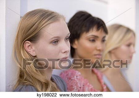 Close-up of three women looking serious View Large Photo Image Stock Image - Close-up of three women looking serious. Fotosearch