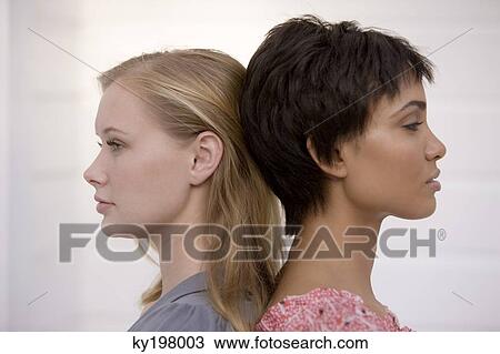 Close-up of two women looking displeased View Large Photo Image Stock Image - Close-up of two women looking displeased. Fotosearch