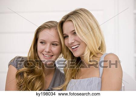 Close-up of two women smiling View Large Photo Image Picture - Close-up of two women smiling. Fotosearch