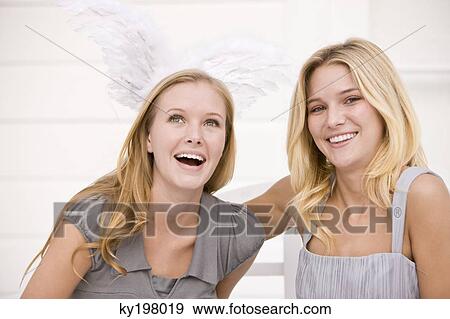 Close-up of two women smiling View Large Photo Image Stock Photo - Close-up of two women smiling. Fotosearch