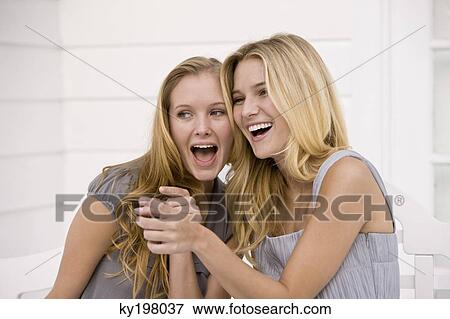 Close-up of two women smiling View Large Photo Image Stock Photo - Close-up of two women smiling. Fotosearch
