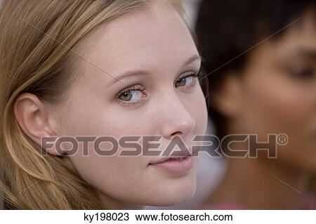 Stock Image - Portrait of a woman with her friend. Fotosearch