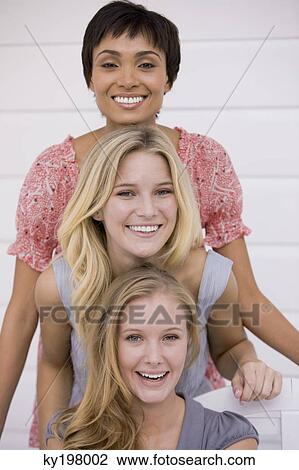 Portrait of three women smiling View Large Photo Image Stock Image - Portrait of three women smiling. Fotosearch