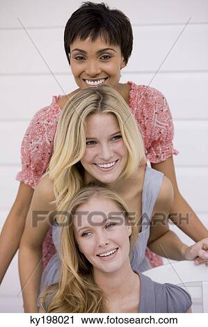 Portrait of three women smiling View Large Photo Image Stock Image - Portrait of three women smiling. Fotosearch