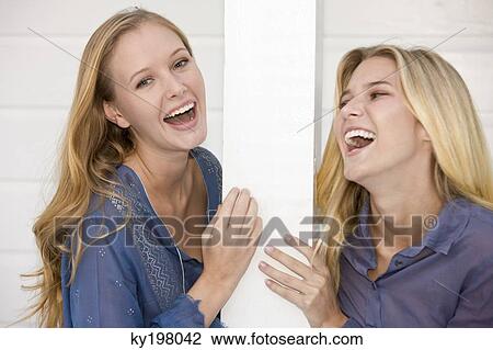 Two women laughing View Large Photo Image Stock Image - Two women laughing. Fotosearch