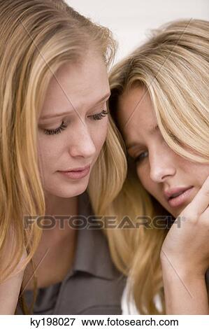 Woman consoling her friend View Large Photo Image Stock Photo - Woman consoling her friend. Fotosearch