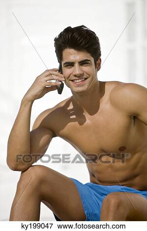 Man talking on a mobile phone View Large Photo Image Stock Photo - Man talking on a mobile phone. Fotosearch