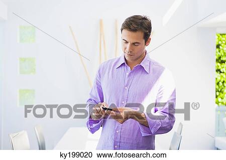 Man text messaging View Large Photo Image Stock Image - Man text messaging. Fotosearch