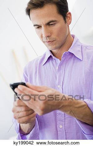 Man text messaging View Large Photo Image Stock Image - Man text messaging. Fotosearch