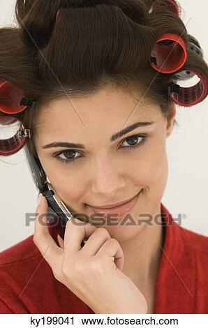 Woman talking on a mobile phone View Large Photo Image Stock Image - Woman talking on a mobile phone. Fotosearch