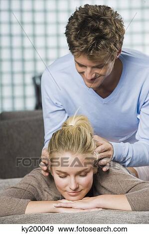 Man rubbing temples of a woman View Large Photo Image Stock Photo - Man rubbing temples of a woman. Fotosearch