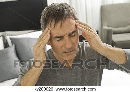 Man suffering from headache View Large Photo Image Stock Photograph - Man suffering from headache. Fotosearch