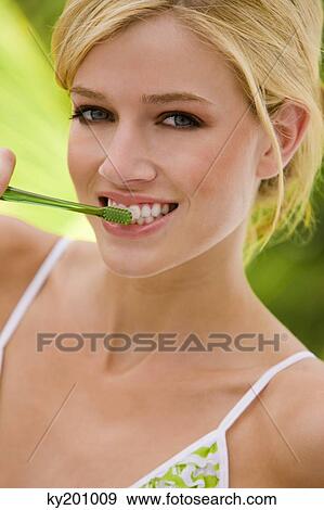 Woman brushing teeth View Large Photo Image Stock Photo - Woman brushing teeth. Fotosearch