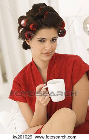 Woman holding a coffee cup View Large Photo Image Stock Photo - Woman holding a coffee cup. Fotosearch