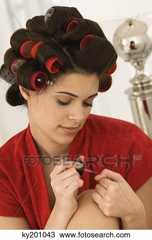 Woman painting finger nails View Large Photo Image Stock Image - Woman painting finger nails. Fotosearch