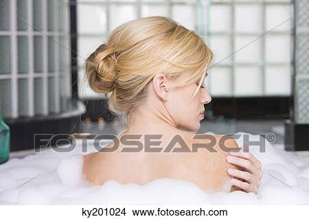 Woman taking a bubble bath View Large Photo Image Picture - Woman taking a bubble bath. Fotosearch