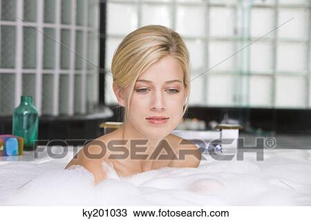Woman taking a bubble bath View Large Photo Image Stock Image - Woman taking a bubble bath. Fotosearch