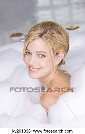 Woman taking a bubble bath View Large Photo Image Stock Photo - Woman taking a bubble bath. Fotosearch