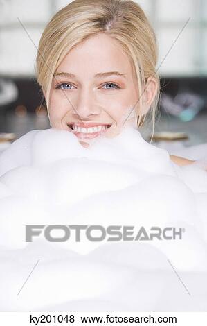 Woman taking a bubble bath View Large Photo Image Stock Photo - Woman taking a bubble bath. Fotosearch