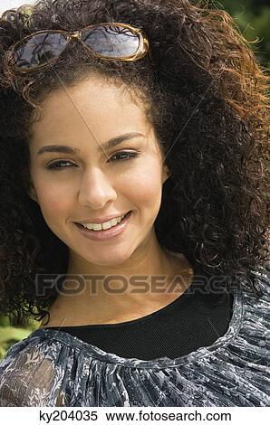 Close-up of a woman smiling View Large Photo Image Stock Photography - Close-up of a woman smiling. Fotosearch