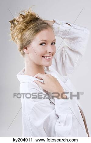 Stock Image - Portrait of a woman smiling. Fotosearch