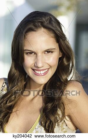 Stock Image - Portrait of a woman smiling. Fotosearch
