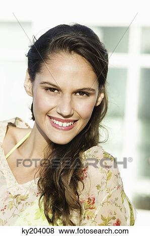 Portrait of a woman smiling View Large Photo Image Stock Photo - Portrait of a woman smiling. Fotosearch