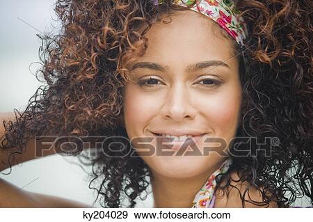 Portrait of a woman smiling View Large Photo Image Stock Photo - Portrait of a woman smiling. Fotosearch