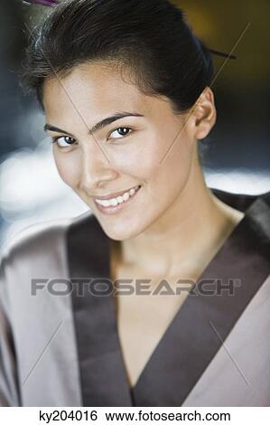 Portrait of a woman smiling View Large Photo Image Stock Photograph - Portrait of a woman smiling. Fotosearch