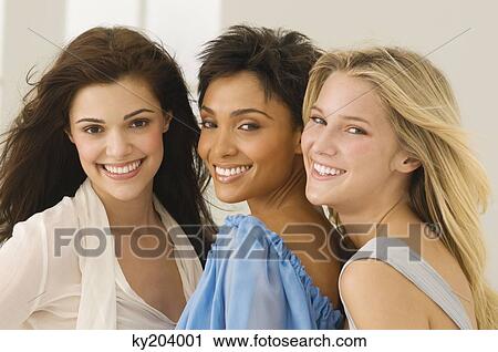 Portrait of three female friends smiling View Large Photo Image Stock Image - Portrait of three female friends smiling. Fotosearch