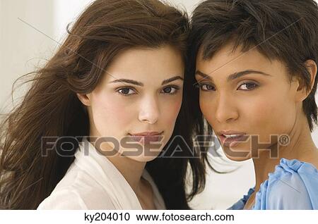Stock Image - Portrait of two female friends. Fotosearch